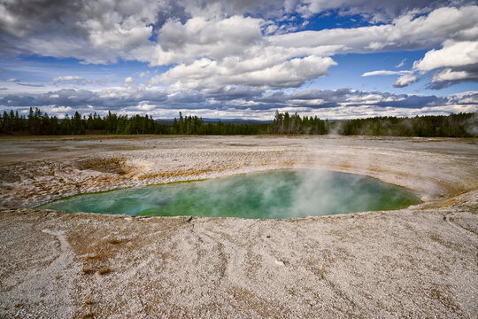 Mid-filled Turquoise Pool, hot spring of colorful green-blue water due to its c.61-71 &ordm;C temperature and suspended minerals. Yellowstone NP-WY-USA-036