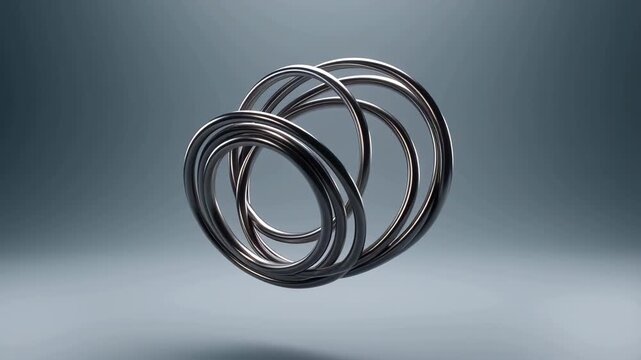 60 FPS Rotating chrome interlocking rings abstract kinetic sculpture on soft gray studio background