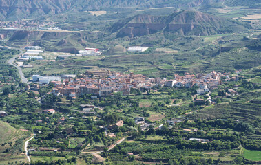 Fototapeta premium Rural Town Among Eroded Hills in La Rioja
