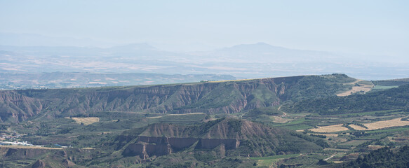 Fototapeta premium Eroded Hills and Hazy Valley Panorama in La Rioja