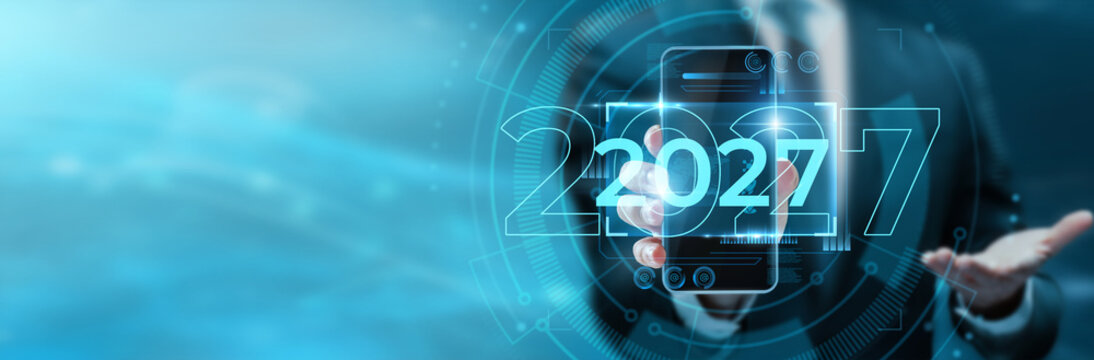 Businessman Holding Digital Phone Showing 2027 Vision for Enterprise Digital Transformation