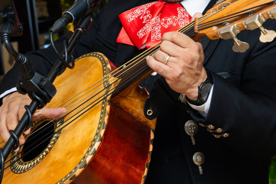 Mexican Mariachi Musician Playing Traditional Guitar
