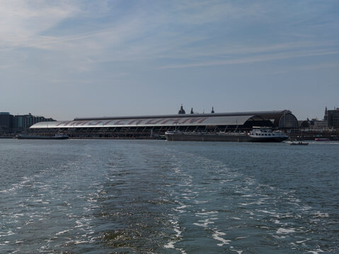 Netherlands - 10 september 2026, Amsterdam: Waterfront Perspective of Amsterdam Central Station