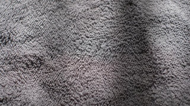 Macro shot of grey microfiber fabric texture background
