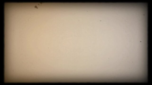 Super 8 film frame grain dust authentic scan with soft light leaks. Film grain for retro look editing.