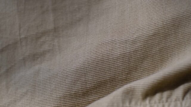 Beige corduroy fabric texture background