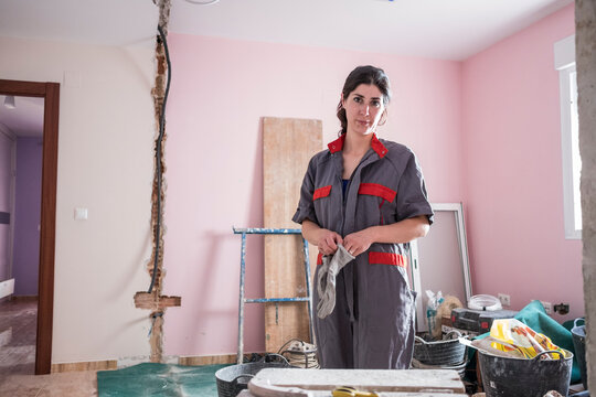 woman working at home with mansonry and renovation