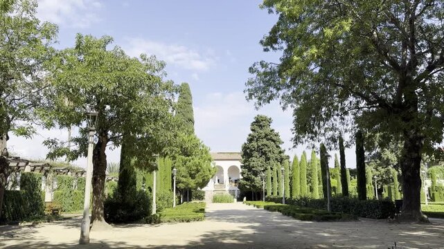 Barcelona, Spain, October 13, 2026 - View of La Greca restaurant, formerly known as La Font del Gat, through the greenery of the historic Laribal Gardens on Montjuic hill.