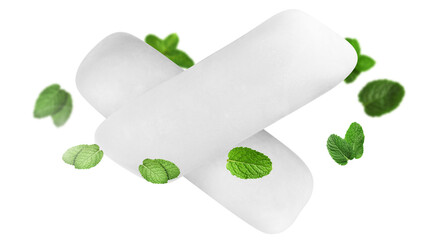 Menthol chewing gum pieces and mint leaves in air against white background © New Africa