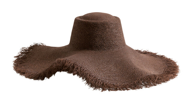 Isolated fashionable woven brown straw hat with large floppy brim and fringed edge