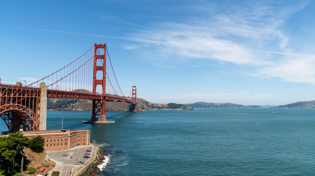 Golden Gate Bridge spanning the entrance of San Francisco Bay, California, USA, with historic Fort Point and the Marin Headlands on a clear summer day