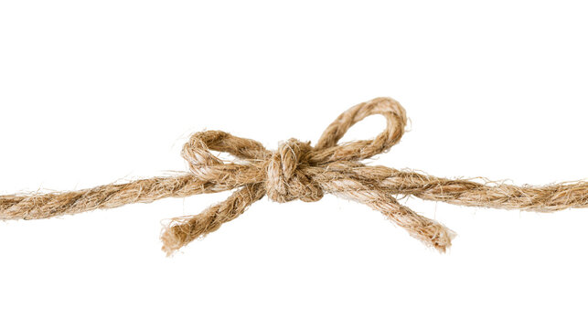 Isolated natural rustic brown jute string tied in a decorative bow knot for a perfect gift.