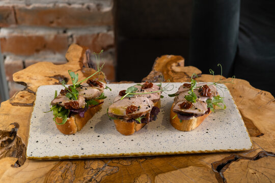 Tasty food displayed on a wooden table at a dining location in the afternoon