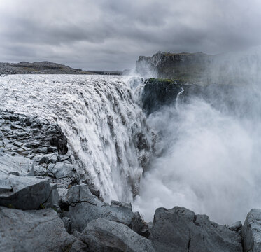 A view of Dettifoss Waterfall in northeastern Iceland on a cloudy overcast Fall day.