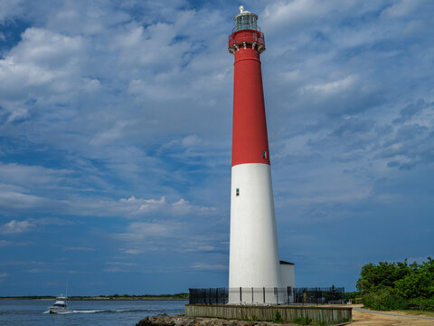Barnegat Lighthouse and Fishing Boat Under Dramatic Clouds, New Jersey