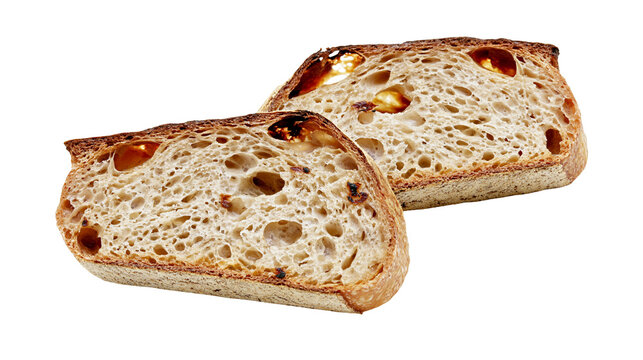 Isolated two delicious slices of artisan sourdough bread with crispy crust and open crumb texture.
