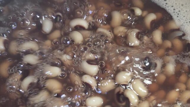motion black eyed peas boiling in bubbling hot water