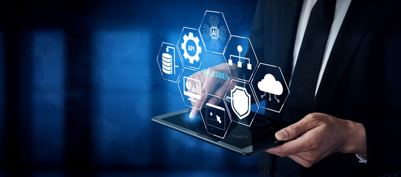 Business Professional Using Touchscreen Tablet with Digital Technology Icons Representing Data Analytics and Cloud Computing Solutions Quark.