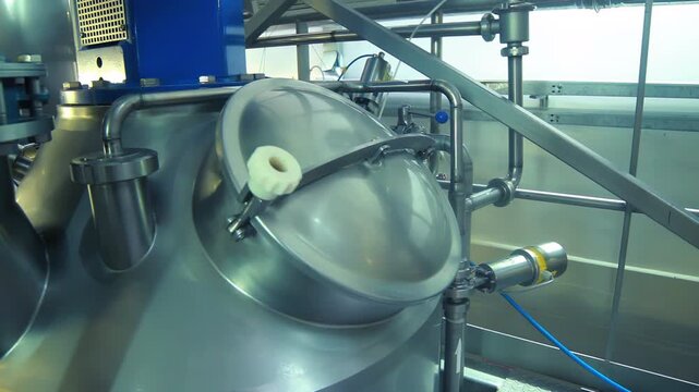 Stainless tank hatch dairy factory. Camera pan pipes valves production line.