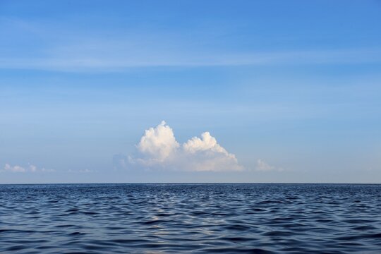 View over blue sea, clouds on the horizon, Lovina Beach, Bali, Indonesia