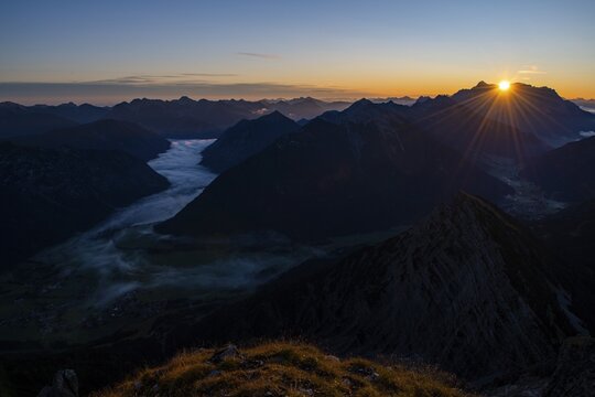 Sunrise over Lechtal Alps with fog in the valley, Berwang, Lechtal, Au&szlig;erfern, Tyrol, Austria