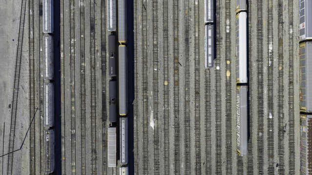 Aerial view of CSX's Radnor Yard and Nashville Intermodal train terminal with numerous freight trains and rail cars parked on parallel tracks in Nashville, TN, United States.