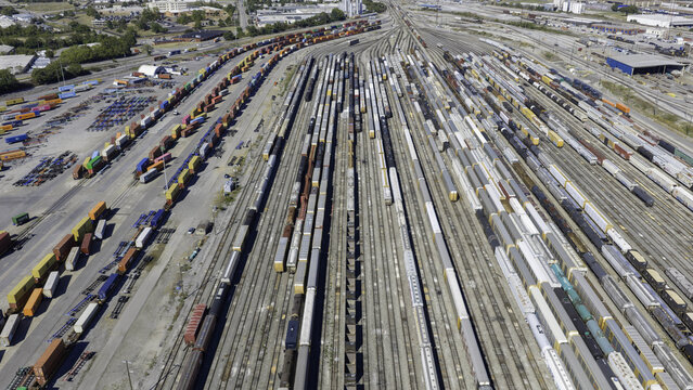 Aerial view of CSX's Radnor Yard and Nashville Intermodal train terminal with freight cars on parallel tracks in an industrial rail yard in Nashville, TN, United States.