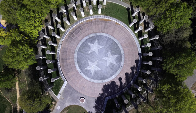 Aerial view of the Court of Three Stars and the 95 Bell Carillon at Bicentennial Capitol Mall State Park surrounded by lush green trees in Nashville, TN, United States.