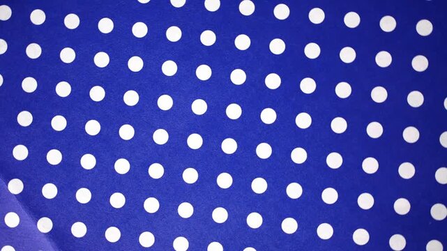 Continuous Panning Blue and White Polka Dot Pattern Background Video