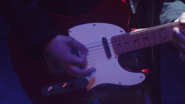 Guitarist Fast Strumming Red Electric Guitar Under Stage Lights Video