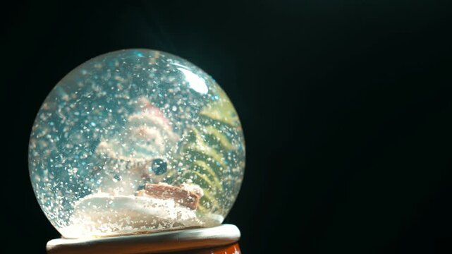 Macro Christmas Snow Globe with Glitter Snow and Copy Space Video