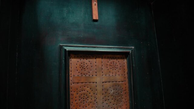 Crucifix with Jesus in an Italian Christian religious confessional