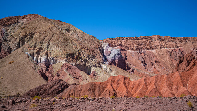 Pre-Hispanic archaeological site with ancient rock art in Rainbow Valley, Atacama Desert.