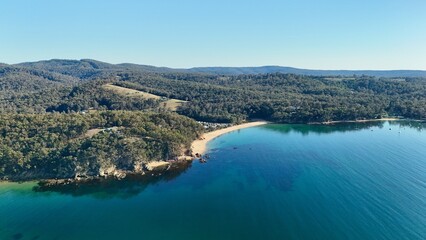 Fototapeta premium Eden, New South Wales, Australia – 4K aerial drone view of Currawulla Beach, Brandy Creek Beach, Legges Beach, Northcote Point, rocky headlands, turquoise Twofold Bay, coastal forest