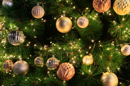 Elegant Christmas Tree Decorated with Gold and Silver Ornaments
