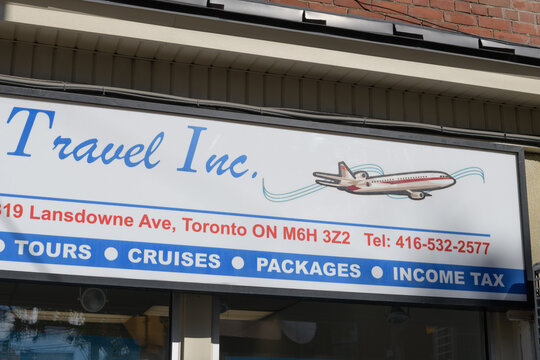 detail of an old vintage sign outside New Friends Travel / Exceptional Travel, a travel agency, located at 819 Lansdowne Av, Toronto