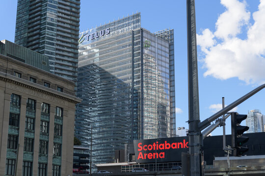 looking northwest to south elevations of Scotiabank Arena sign and the TELUS Harbour from Bay St and Harbour St, Toronto