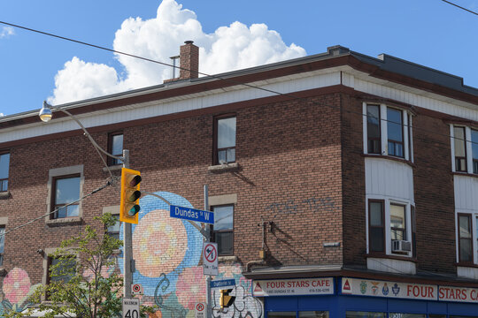 exterior building corner facades with ghost sign of Four Stars Cafe located at 1485 Dundas St W, Toronto
