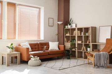 Remote work and home office lifestyle, comfortable living room interior with leather sofa and laptop for freelance professional and digital nomad © Pixel-Shot