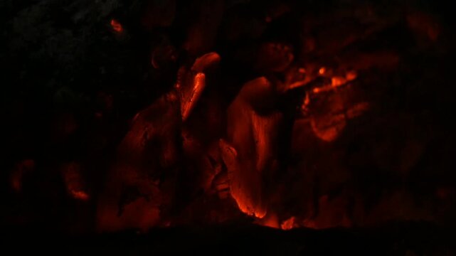 Deep Red Glowing Hot Embers of Charcoal in Complete Darkness