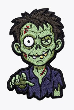 Spooky Halloween embroidered patch featuring a funny green zombie character with stitches and a purple shirt isolated on a white background   