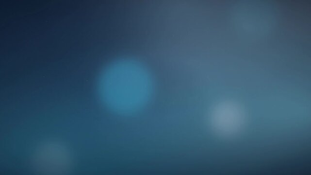 Abstract soft blue bokeh lights flickering on a dark navy background