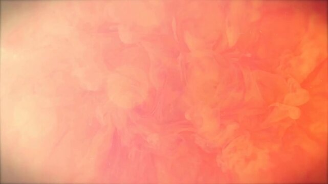 Vibrant orange and peach smoke billowing softly in slow motion creating abstract atmospheric patterns