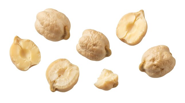 A collection of raw chickpeas, including whole beans and split halves, arranged on a clean white background, showcasing the light beige color and textured surface of these healthy legumes