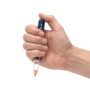 hand holding insulin pen isolated on white
