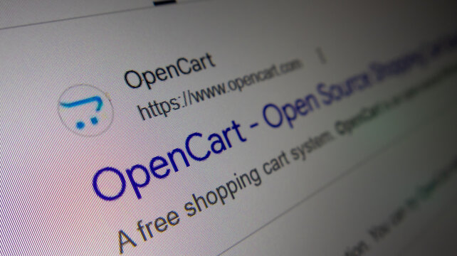 OpenCart website displayed on a screen, an open-source e-commerce platform for online stores.