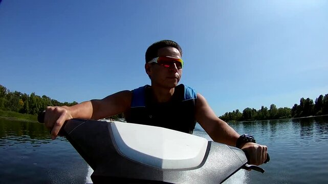 Man riding a jet ski on river