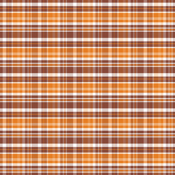Warm autumn toned checkered plaid tartan seamless pattern textile background