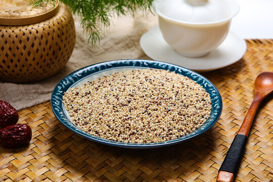 Mixed tri-color quinoa grains in blue ceramic plate
