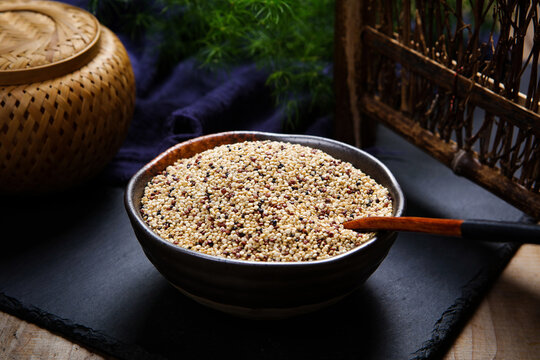Mixed tri-color quinoa grains in blue ceramic plate